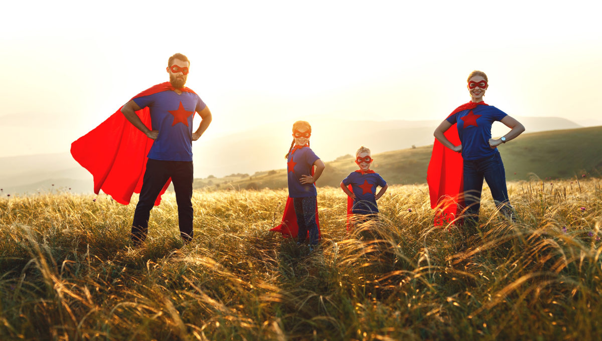 concept of super family, family of superheroes at sunset