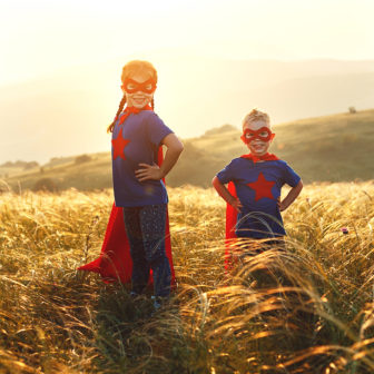 concept of super family, family of superheroes at sunset